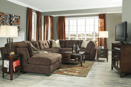 Patterned area rug adds a pop of color to unify the entire room.