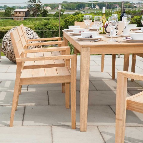 Photo caption: Outdoor table options include solid heartwood in a golden wood grain. Photo credit: Jensen Leisure